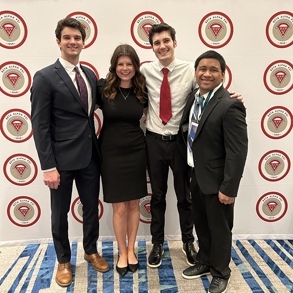 Four students with award