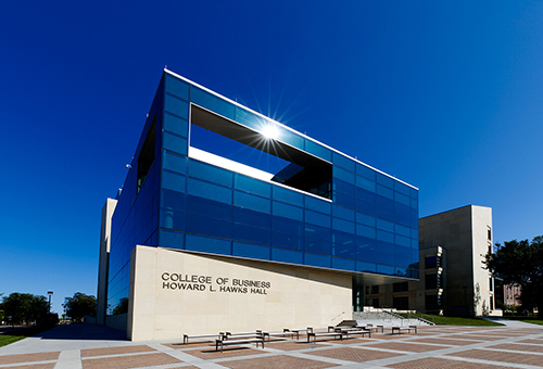 Exterior of building and sign that says College of Business Howard L. Hawks Hall.