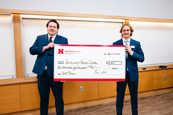 Anderson (left) and Tyler Vander Woude, marketing and management major, won $2,500 in a role-play competition sponsored by NRC Health. 