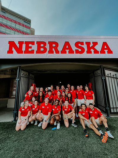 Carlie and other orientation leaders in memorial stadium.