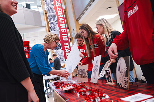 Shoppers interact with four Clifton Builders at the Builders Marketplace.